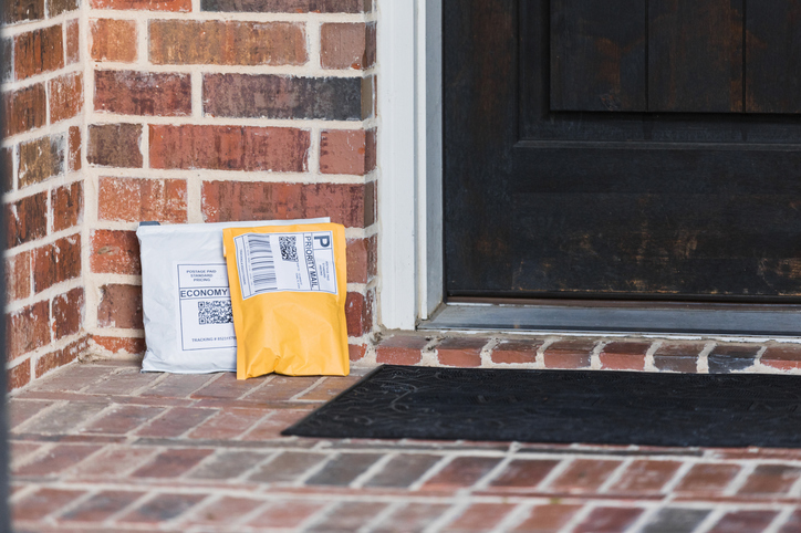 Two packages dropped off on front stoop left unprotected